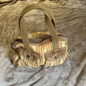 Two handle shoulder bag by Fossil 16 inches across the bottom , orange and tan